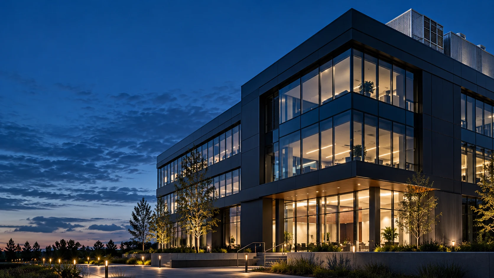 Contemporary glass and steel building at blue hour